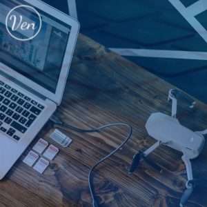 Drone, SD cards and a laptop showing Venetix services